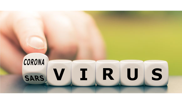 Hand turns a dice and changes the expression "sars virus" to "corona virus".